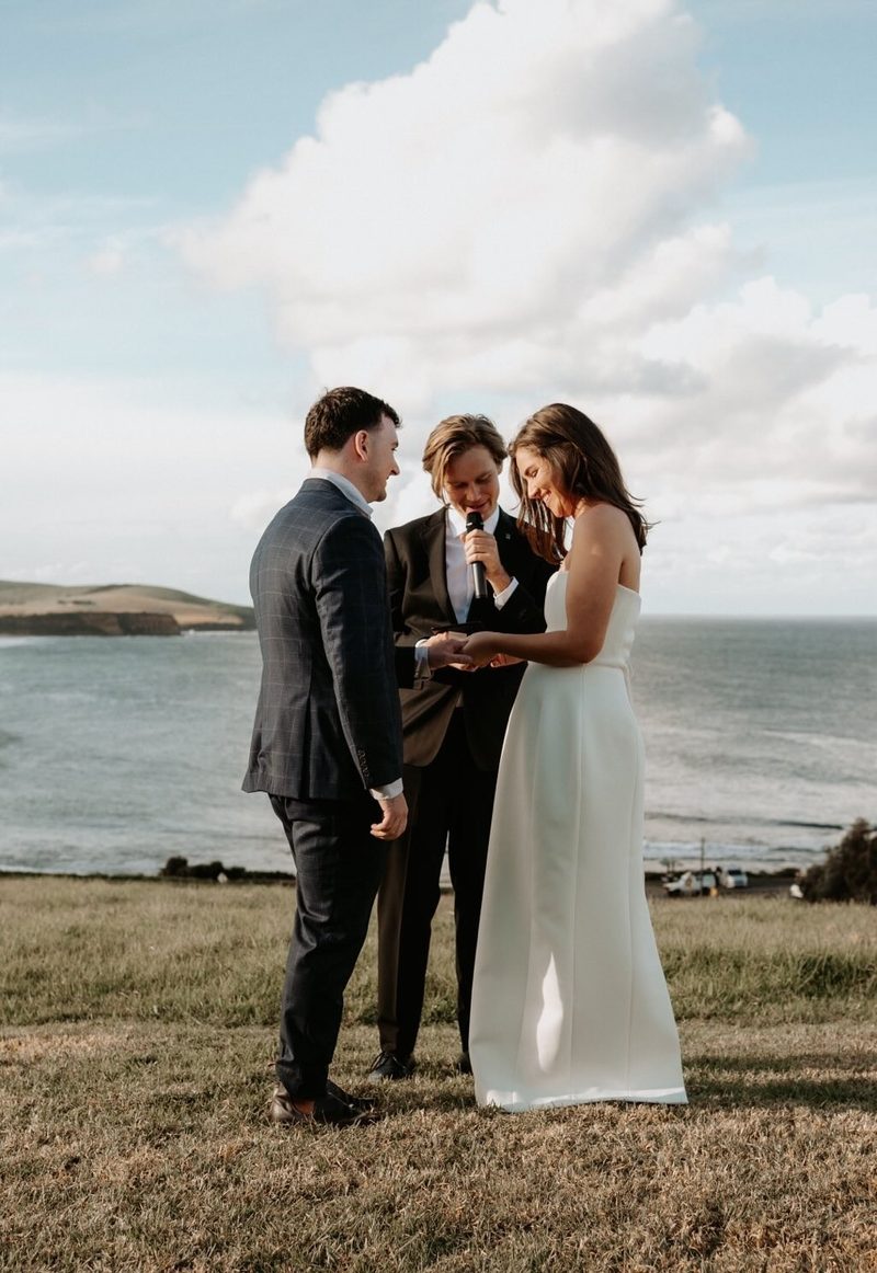 Exchanging vows on the headland overlooking the sea